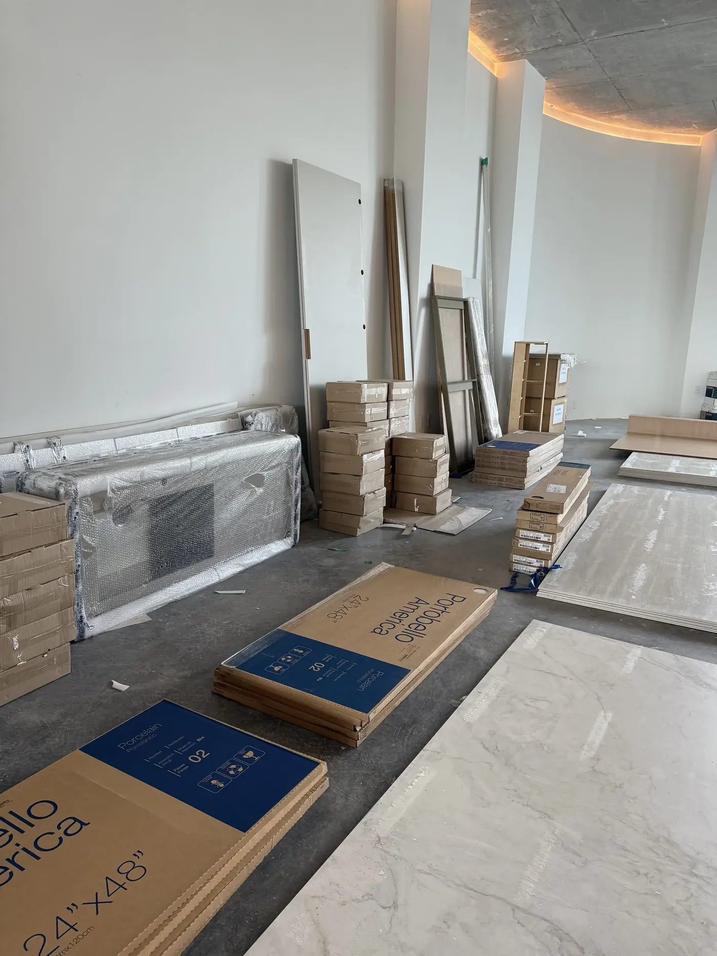 Wrapped showroom materials staged during a five-day commercial move in Wynwood