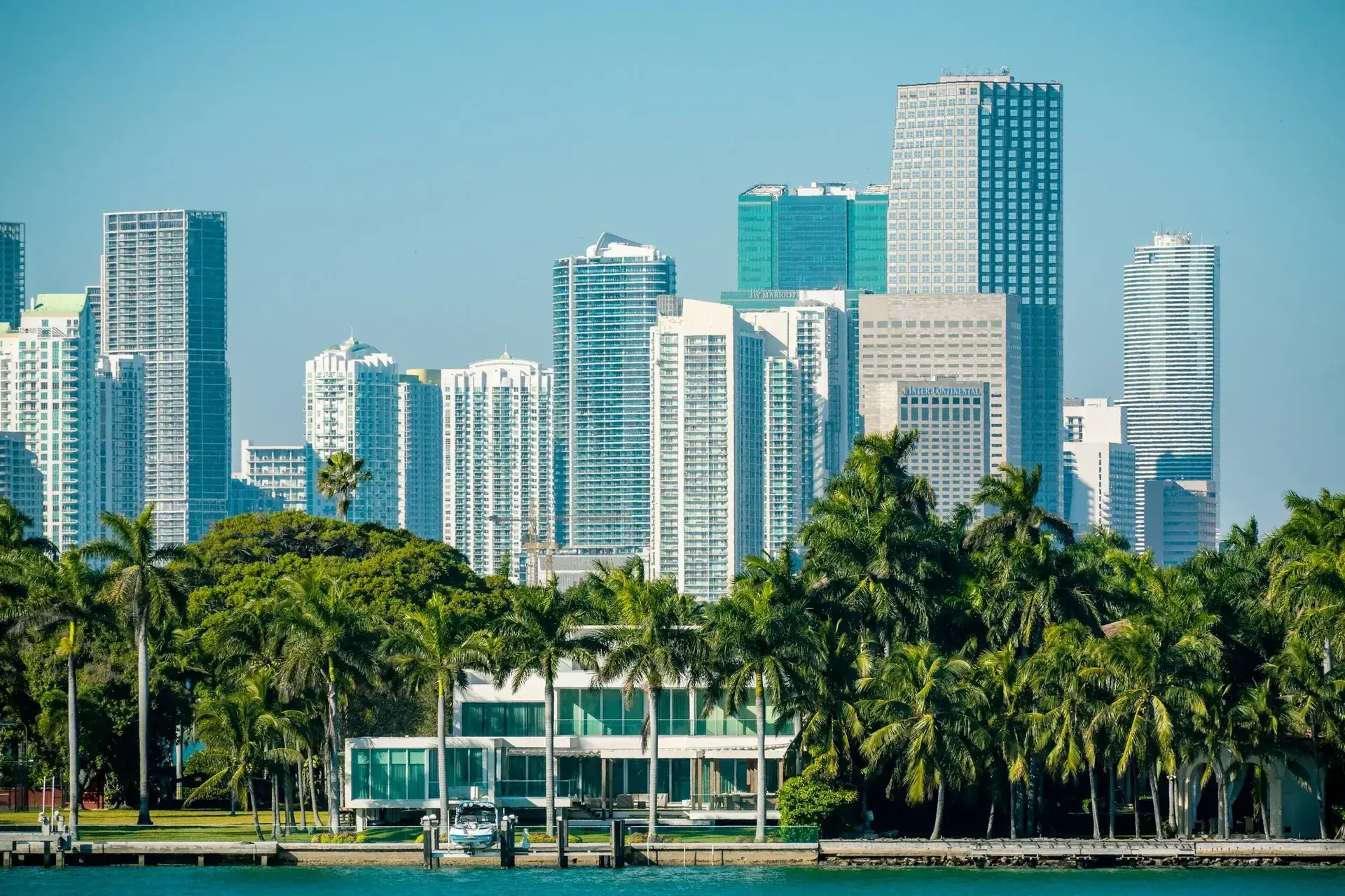 Downtown Miami skyline behind palm trees for a relocation guide