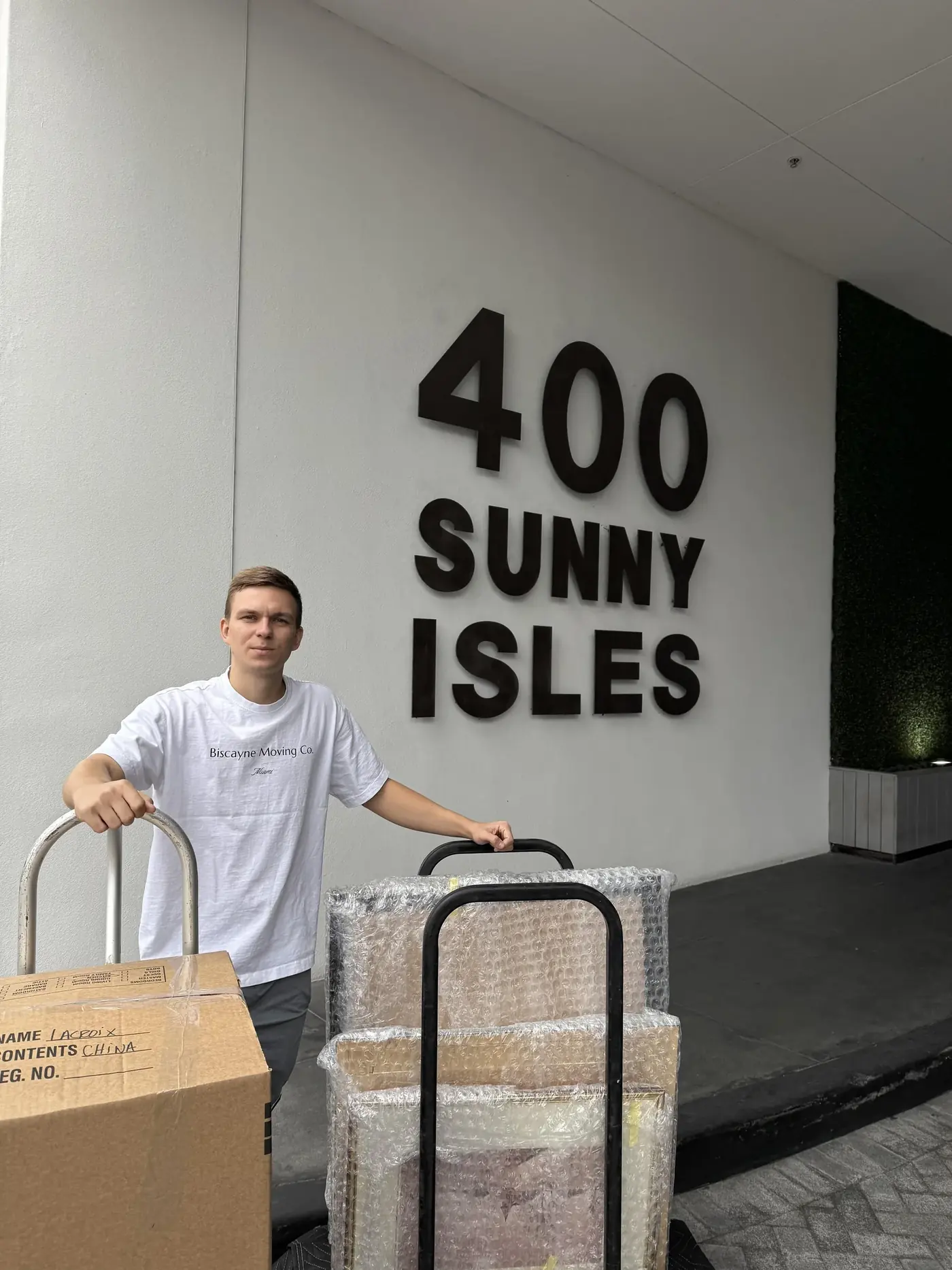 Biscayne Moving Co. mover with a dolly at 400 Sunny Isles during a condo move