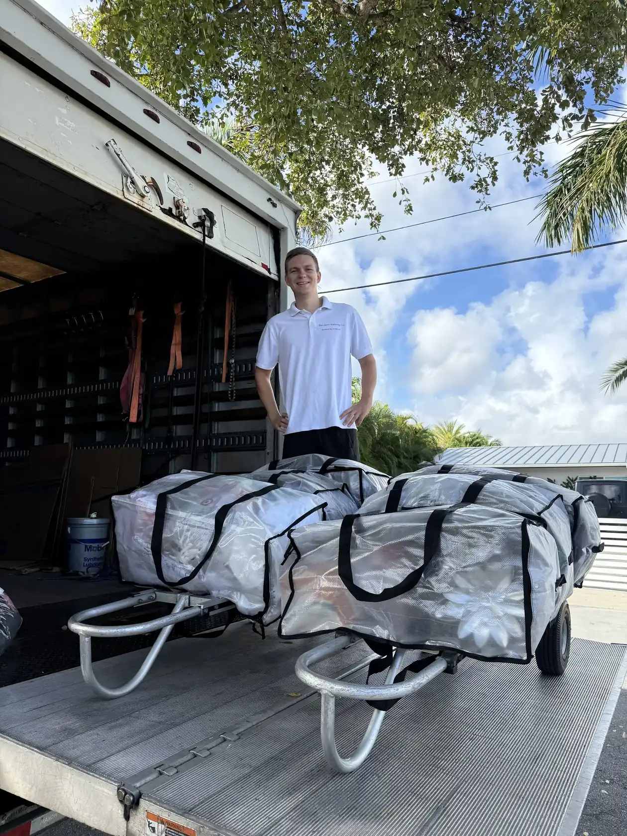 Mover carrying a shelving unit during a Hallandale Beach move