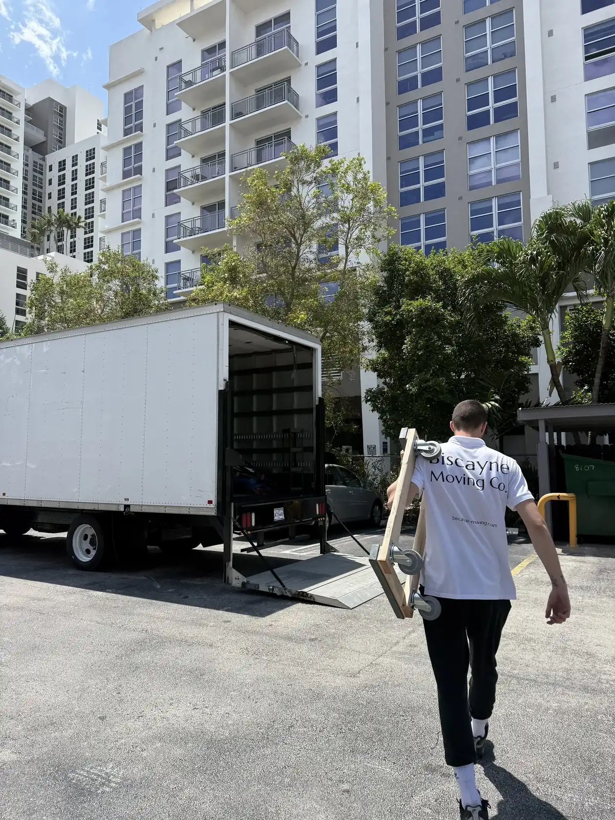 Condo movers in Miami protecting furniture during an apartment move