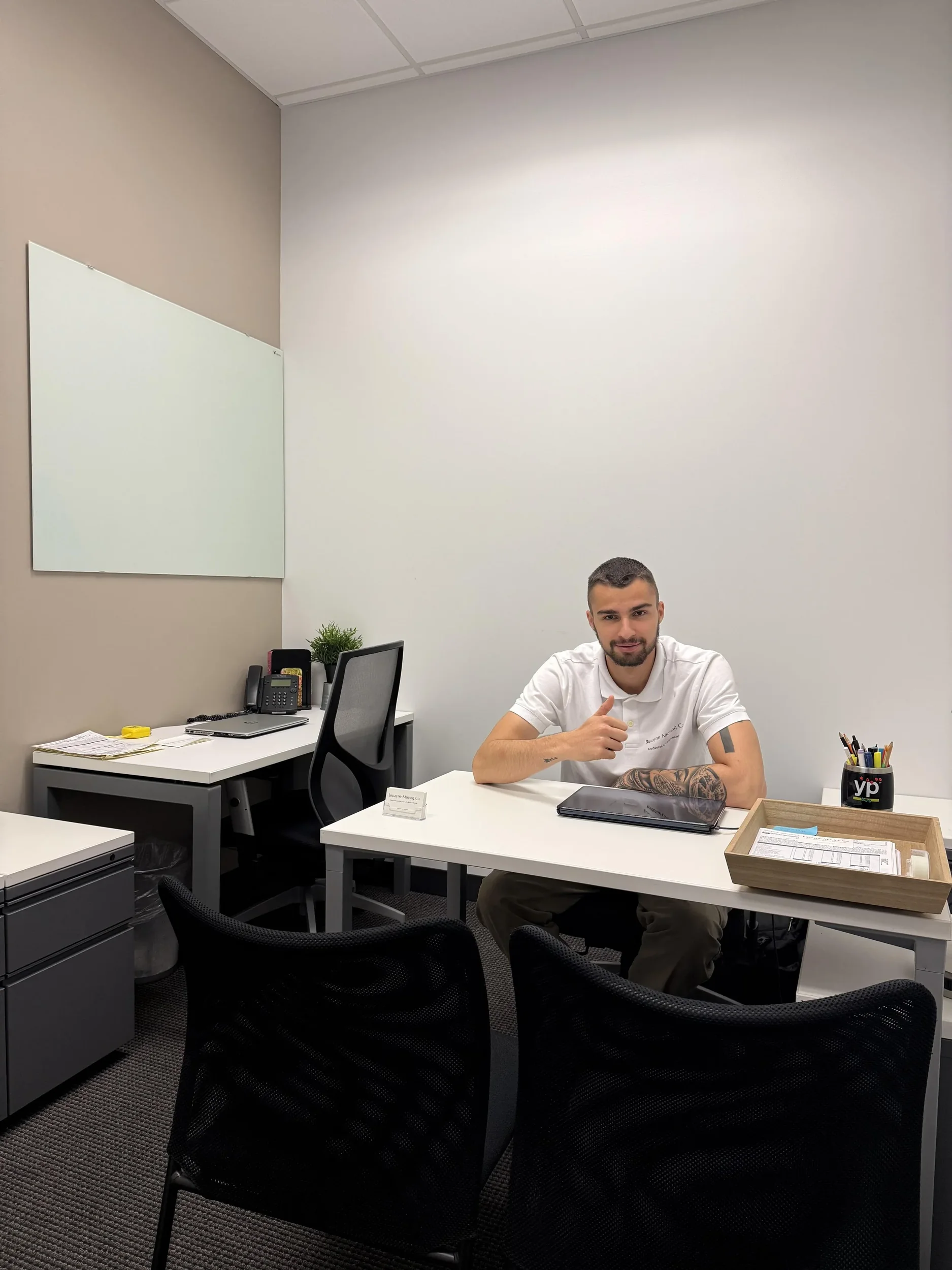Biscayne Moving Co. team member at his desk in the company office