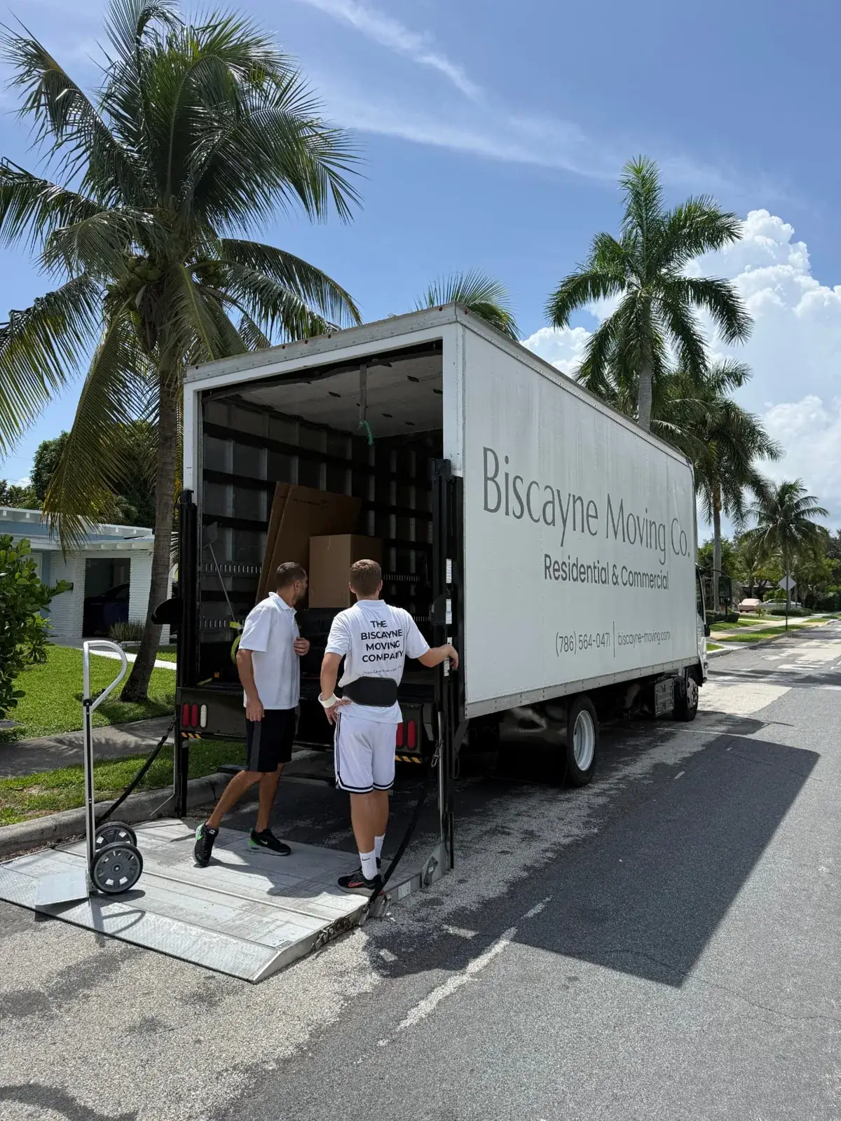 Biscayne Moving Co. crew loading furniture into a truck during a Miami local move
