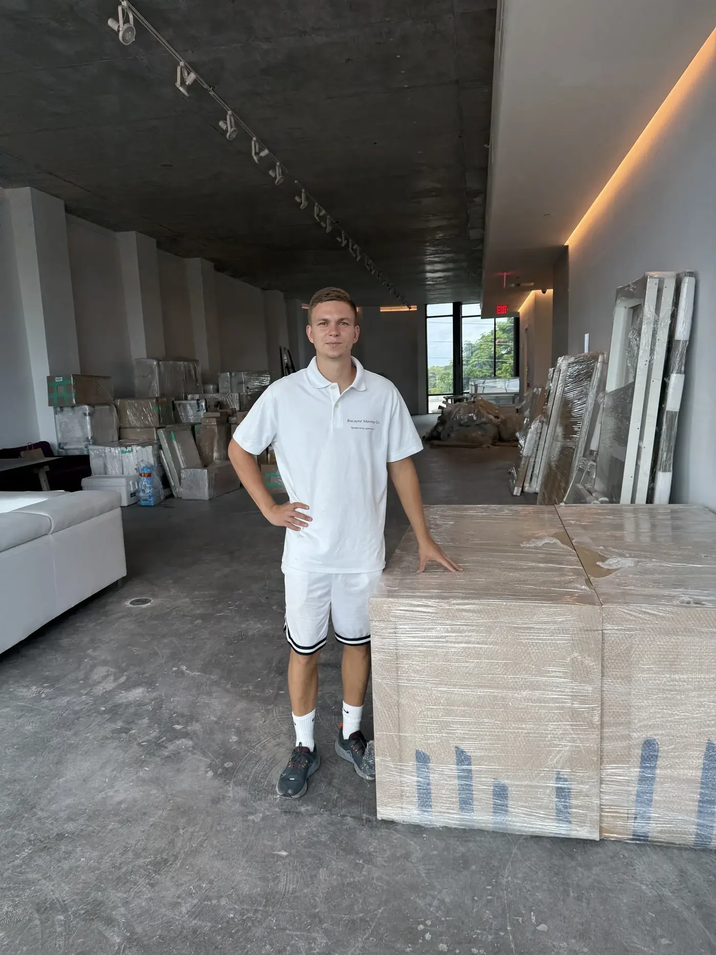 Packed showroom counters and fixtures during a Wynwood commercial move