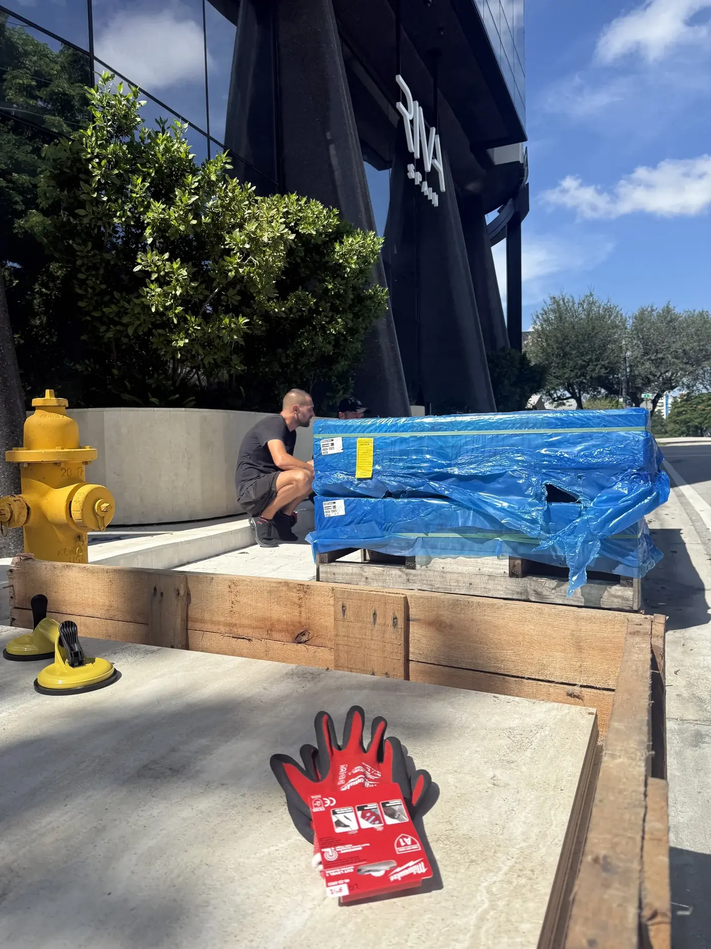 Ceramic tile crates being opened during a Wynwood commercial move