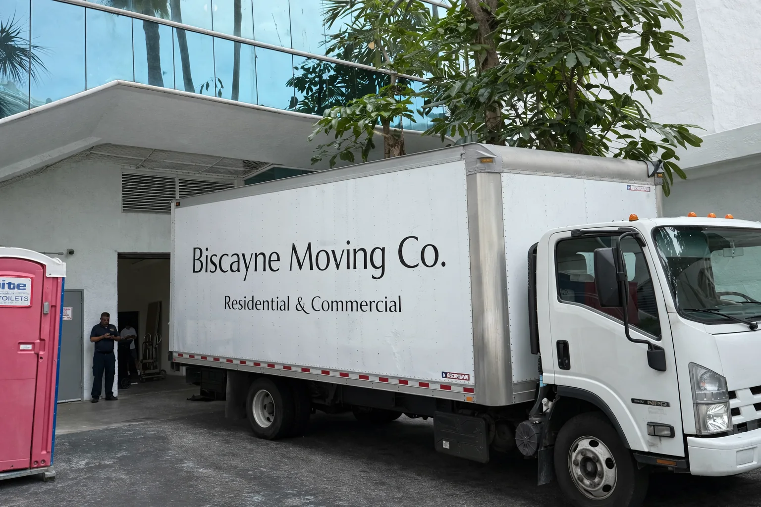 Biscayne Moving Co. truck on a palm-lined street for a Miami mover selection guide