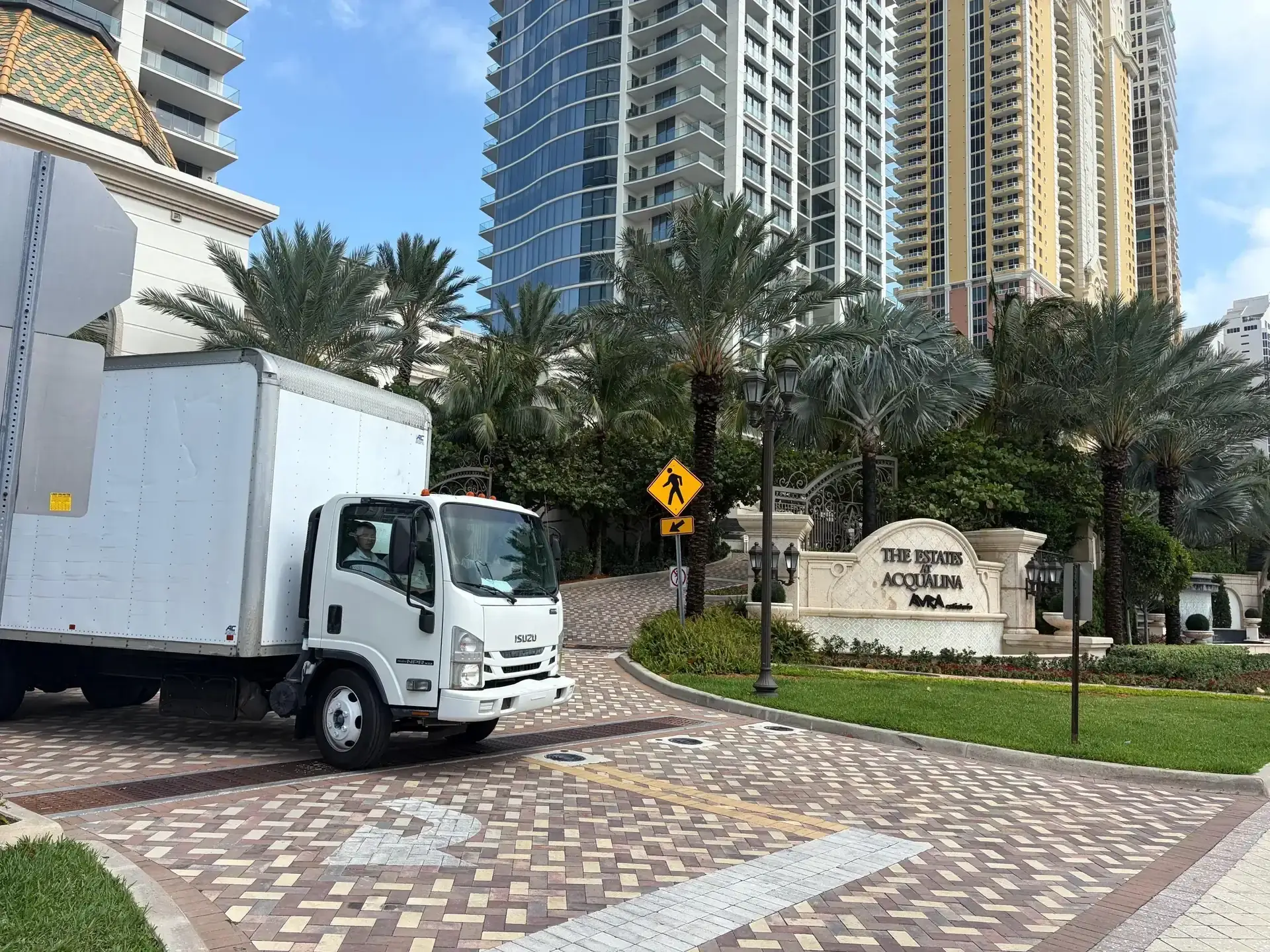 Biscayne Moving Co. truck outside a Miami condo tower