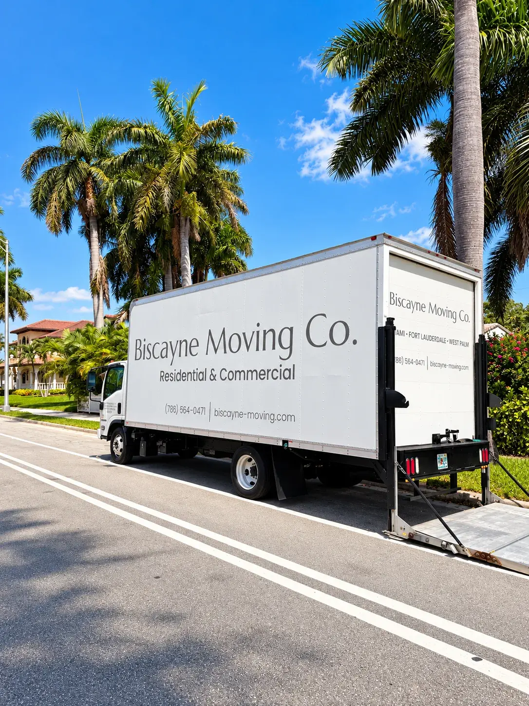Biscayne Moving Co. truck parked on a palm-lined Fort Lauderdale street