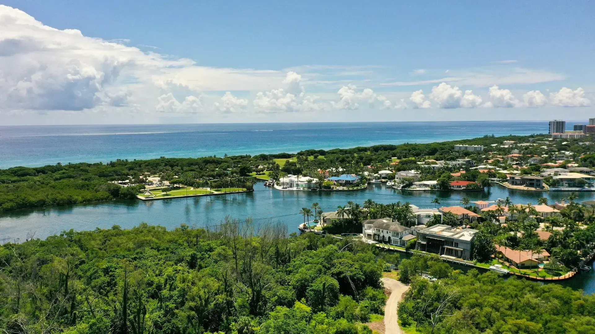 Aerial view of waterfront homes, mangroves, and the ocean in Boca Raton