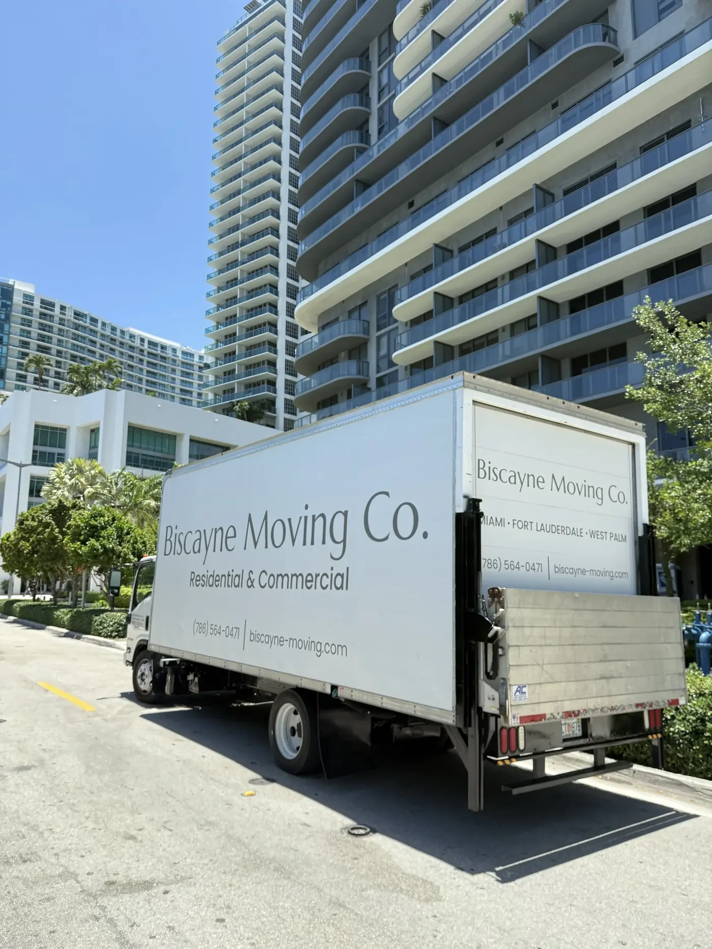 Biscayne Moving Co. truck parked beside a Miami high-rise